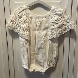Ivory baby romper with lace flutter sleeves